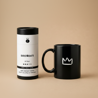 Baristocrats Mt Siyeh Single Origin Instant canister next to black crown mug with handle